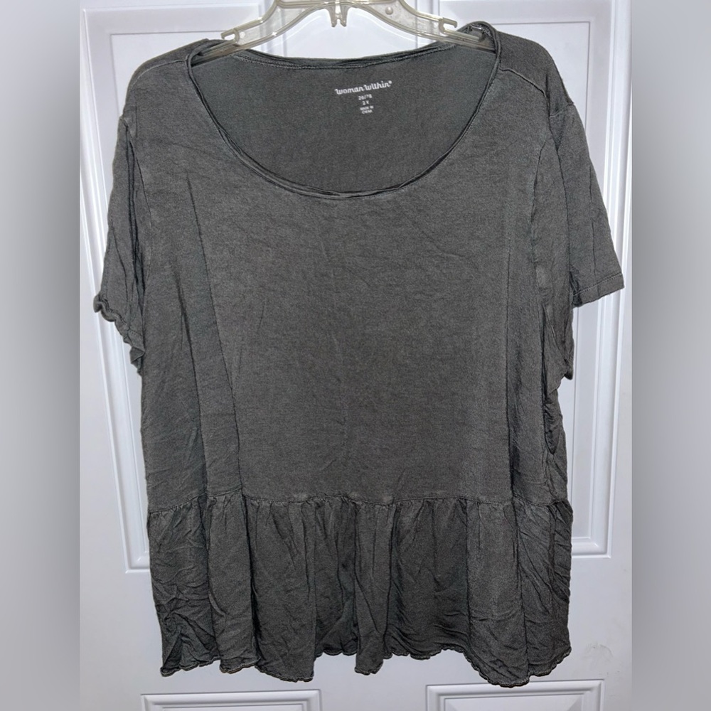 Woman within babydoll style shirt sleeved shirt